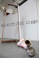 poster for “Beautiful Liars” Exhibition