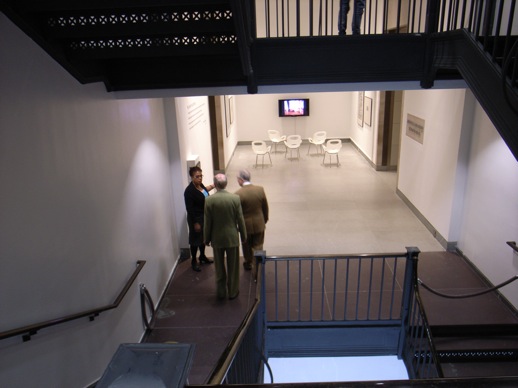  ''The artist,'' continuing a walk around the exhibition, descends to the lower of the two exhibition floors.