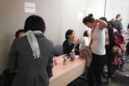 Guests buying art. 
Photo: Yasutaka Kojima