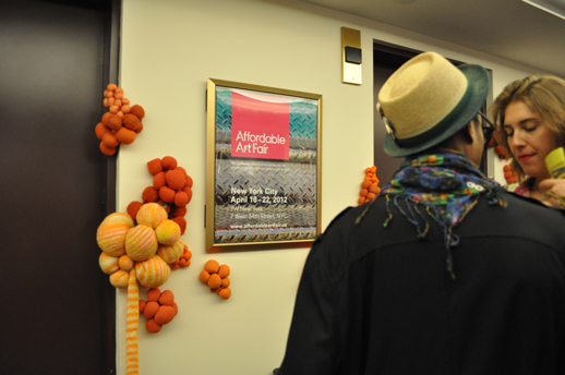 One of installations in the venue. Orange Jelly, 2012. Sweaters, polyfill, zip ties. Dimentions variable